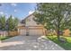 Two-story house with a three-car garage and basketball hoop at 18872 E Prentice Pl, Centennial, CO 80015