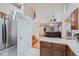 Open concept kitchen with island and stainless steel appliances at 18872 E Prentice Pl, Centennial, CO 80015