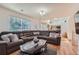 Open living room with a view of the kitchen and access to the backyard at 18872 E Prentice Pl, Centennial, CO 80015