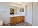Double vanity bathroom with updated cabinetry and lighting at 18872 E Prentice Pl, Centennial, CO 80015