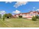 Ranch-style home with red trim and a spacious deck at 12155 Mesa View Rd, Larkspur, CO 80118