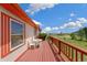 Spacious deck with scenic views and outdoor seating at 12155 Mesa View Rd, Larkspur, CO 80118