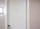 Private entrance with modern white door at 12983 W Ida Ave # 107 Ada Type A, Littleton, CO 80127