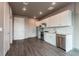 Modern kitchen with white cabinets and stainless steel appliances at 12983 W Ida Ave # 107 Ada Type A, Littleton, CO 80127