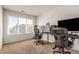 Spacious home office with large window and two ergonomic chairs at 15195 E 16Th Pl # 204, Aurora, CO 80011