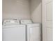 Bright laundry room, featuring a washer and dryer, in a closet at 15195 E 16Th Pl # 204, Aurora, CO 80011