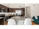 Modern kitchen island with granite countertop and stainless steel appliances at 15195 E 16Th Pl # 204, Aurora, CO 80011