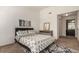 Spacious bedroom with carpeted floor and ensuite bathroom access at 15195 E 16Th Pl # 204, Aurora, CO 80011