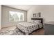 Well-lit bedroom with large window, carpeted floor, and neutral decor at 15195 E 16Th Pl # 204, Aurora, CO 80011