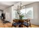 Dining area with hardwood floors, glass-top table and window seating at 15195 E 16Th Pl # 204, Aurora, CO 80011