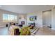 Living room features a fireplace, large windows, and a sectional sofa at 811 Horizon Ct, Erie, CO 80516