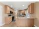 Bright kitchen with stainless steel appliances and light wood cabinets at 4761 S Flat Rock Ct, Aurora, CO 80016