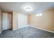 Finished basement bedroom with carpet and double door closet at 8089 Greenwood Blvd, Denver, CO 80221