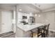 Small, well-equipped basement kitchen with granite countertop and island at 1170 Mcmurdo Cir, Castle Rock, CO 80108