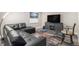 Finished basement recreation room with comfortable seating and large TV at 1170 Mcmurdo Cir, Castle Rock, CO 80108