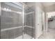 Clean bathroom with a large walk-in shower and tile surround at 1170 Mcmurdo Cir, Castle Rock, CO 80108