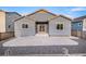 Rear view of house, gray siding, patio, and gravel yard at 1170 Mcmurdo Cir, Castle Rock, CO 80108