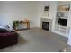 Relaxing living room featuring a fireplace and built-in shelving at 19583 E Hollow Creek Dr, Parker, CO 80134