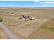 Aerial view of house, barn, and surrounding land; view from a road at 3188 S County Road 137, Bennett, CO 80102