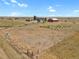Aerial view of property showing house, barn, and expansive land at 3188 S County Road 137, Bennett, CO 80102