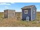 Image shows two outbuildings on a property; one is a small shed and the other is a larger, wooden structure at 3188 S County Road 137, Bennett, CO 80102