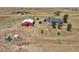 Aerial view of property with house, barn and outbuildings at 3188 S County Road 137, Bennett, CO 80102
