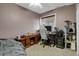 Basement bedroom with desk and cat tree at 3188 S County Road 137, Bennett, CO 80102