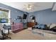 Basement bedroom with desk, TV, and dog crate at 3188 S County Road 137, Bennett, CO 80102