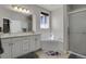 Bathroom with double vanity, soaking tub, and shower at 3188 S County Road 137, Bennett, CO 80102