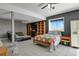 Finished basement bedroom with built-in shelving and window views at 3188 S County Road 137, Bennett, CO 80102