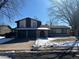 Two-story house with a two-car garage and landscaping at 11742 E Jewell Pl, Aurora, CO 80012