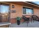 Inviting front porch with wicker chairs and potted plants at 1465 S Depew St, Lakewood, CO 80232