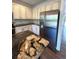 Modern kitchen with granite countertops and stainless steel appliances at 6043 S Waco St, Aurora, CO 80016