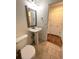 Clean bathroom with pedestal sink and tiled floor at 6043 S Waco St, Aurora, CO 80016
