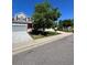Two-story home with gray siding, brick accents, and a two-car garage at 6043 S Waco St, Aurora, CO 80016