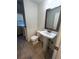 Clean and updated bathroom with pedestal sink at 6043 S Waco St, Aurora, CO 80016