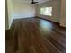 Large living room with hardwood floors and big windows at 6043 S Waco St, Aurora, CO 80016