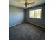 Grey bedroom with ceiling fan and carpet at 6043 S Waco St, Aurora, CO 80016