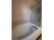 Soaking tub with shower in a spacious bathroom at 6043 S Waco St, Aurora, CO 80016