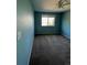 Spacious bedroom with light blue walls and carpet at 6043 S Waco St, Aurora, CO 80016