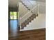 Bright and airy entrance with a stunning staircase at 6043 S Waco St, Aurora, CO 80016