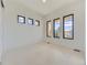 Bright bedroom with neutral carpeting, large windows, and stunning views at 3534 Running Deer Dr, Castle Rock, CO 80109