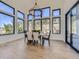 Bright dining room with hardwood floors, large windows, and access to a patio at 3534 Running Deer Dr, Castle Rock, CO 80109