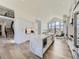 Spacious kitchen boasts modern island, stainless steel appliances, and light-filled dining area at 3534 Running Deer Dr, Castle Rock, CO 80109