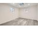 Spacious bedroom with vinyl plank flooring and two windows at 10667 Lowry Pl, Aurora, CO 80010