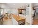 Modern kitchen with white cabinets, butcher block island, and stainless steel appliances at 160 Bristlecone Way, Boulder, CO 80304