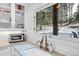 Kitchen features white cabinets, marble countertops, and a view of the backyard at 160 Bristlecone Way, Boulder, CO 80304