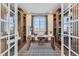 Home office with built-in shelving, a large desk, and natural light at 13785 Emerald Lake St, Parker, CO 80138