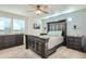 Spacious main bedroom with large bed, dark wood dresser, and ceiling fan at 249 S Old Hammer St, Aurora, CO 80018