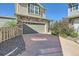 House exterior showcasing a brick facade, driveway, and landscaping at 249 S Old Hammer St, Aurora, CO 80018